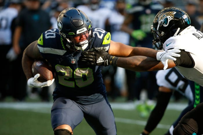 NFL: Jacksonville Jaguars at Seattle Seahawks Oct 31, 2021; Seattle, Washington, USA; Seattle Seahawks running back Rashaad Penny (20) rushes against the Jacksonville Jaguars during the fourth quarter at Lumen Field.